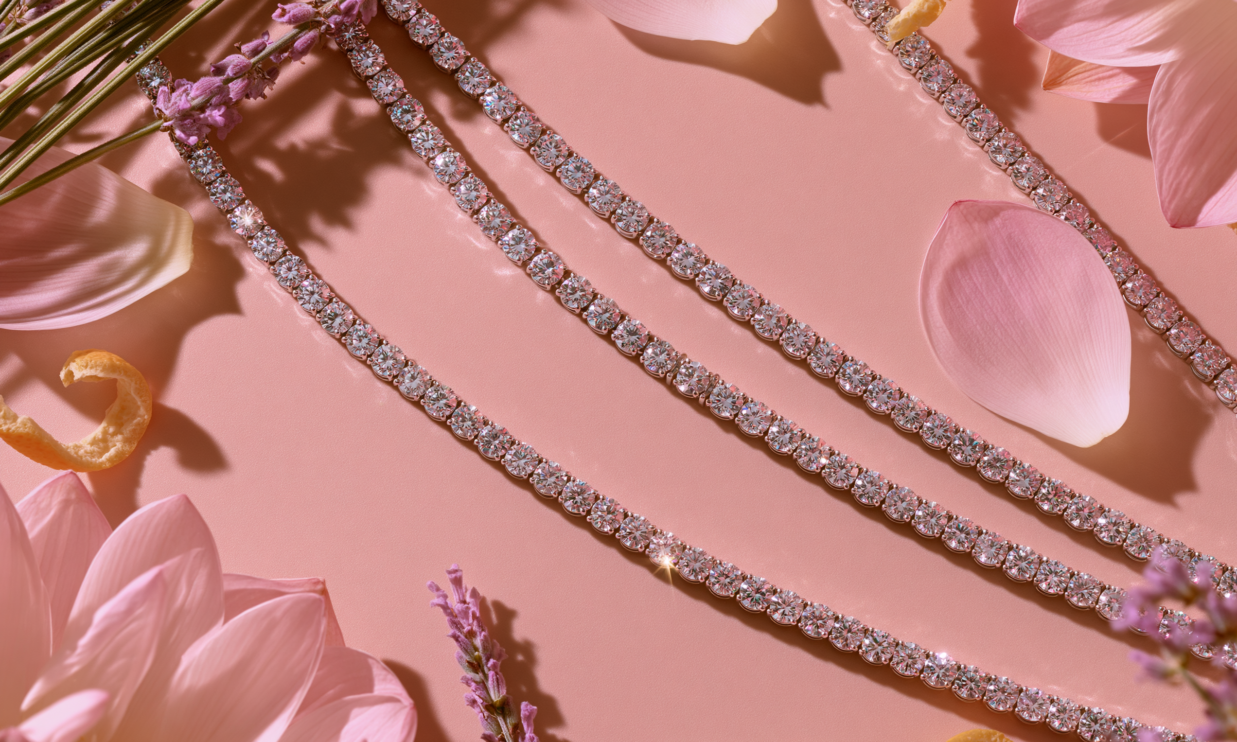 Diamond bracelets on a pink floral background