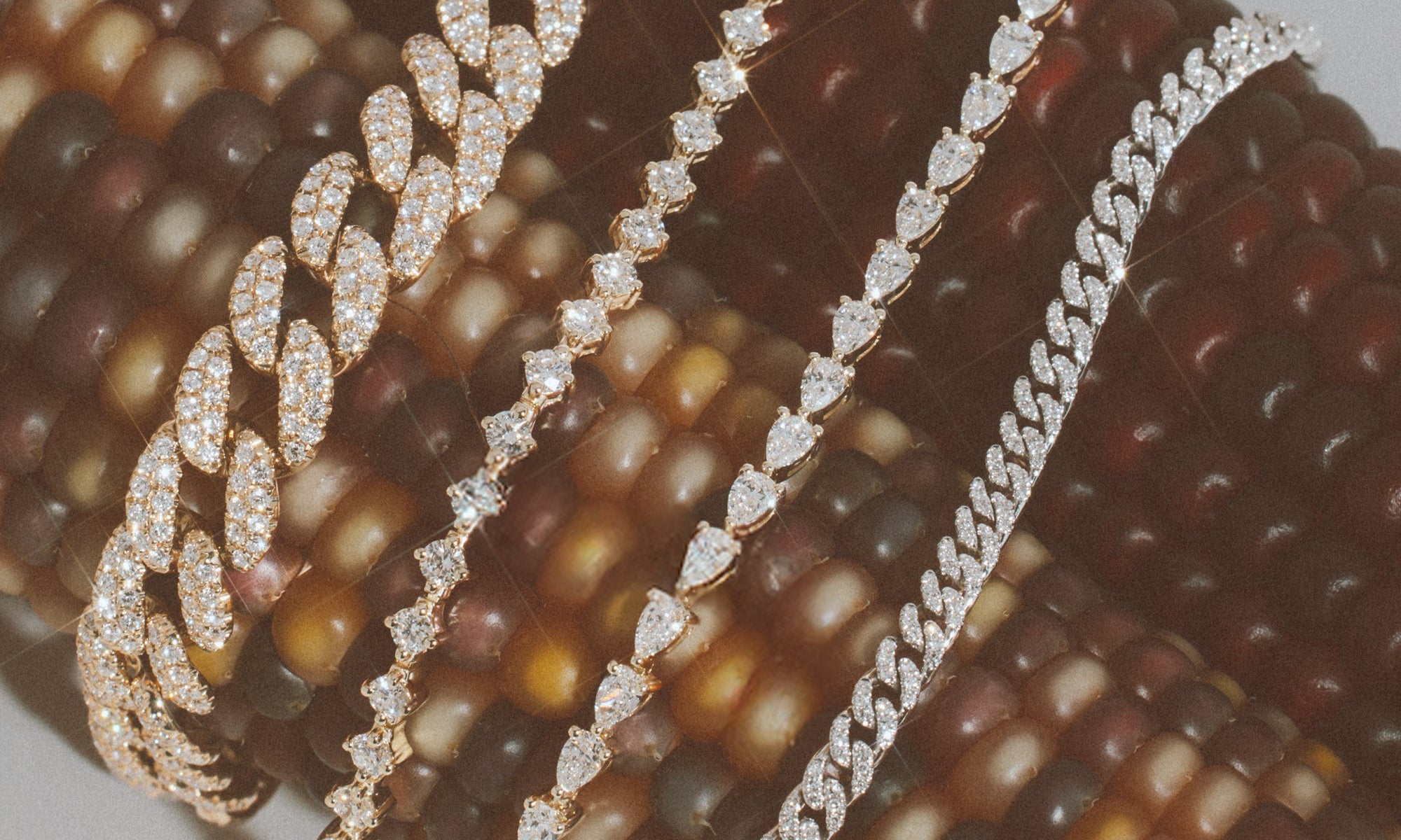 Diamond bracelets on a pink floral background