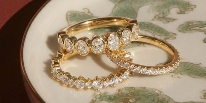 bezel oval ring, pave diamond ring, and north star diamond ring