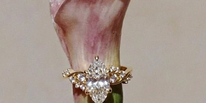 ariel engagement ring on hand splashing ocean water