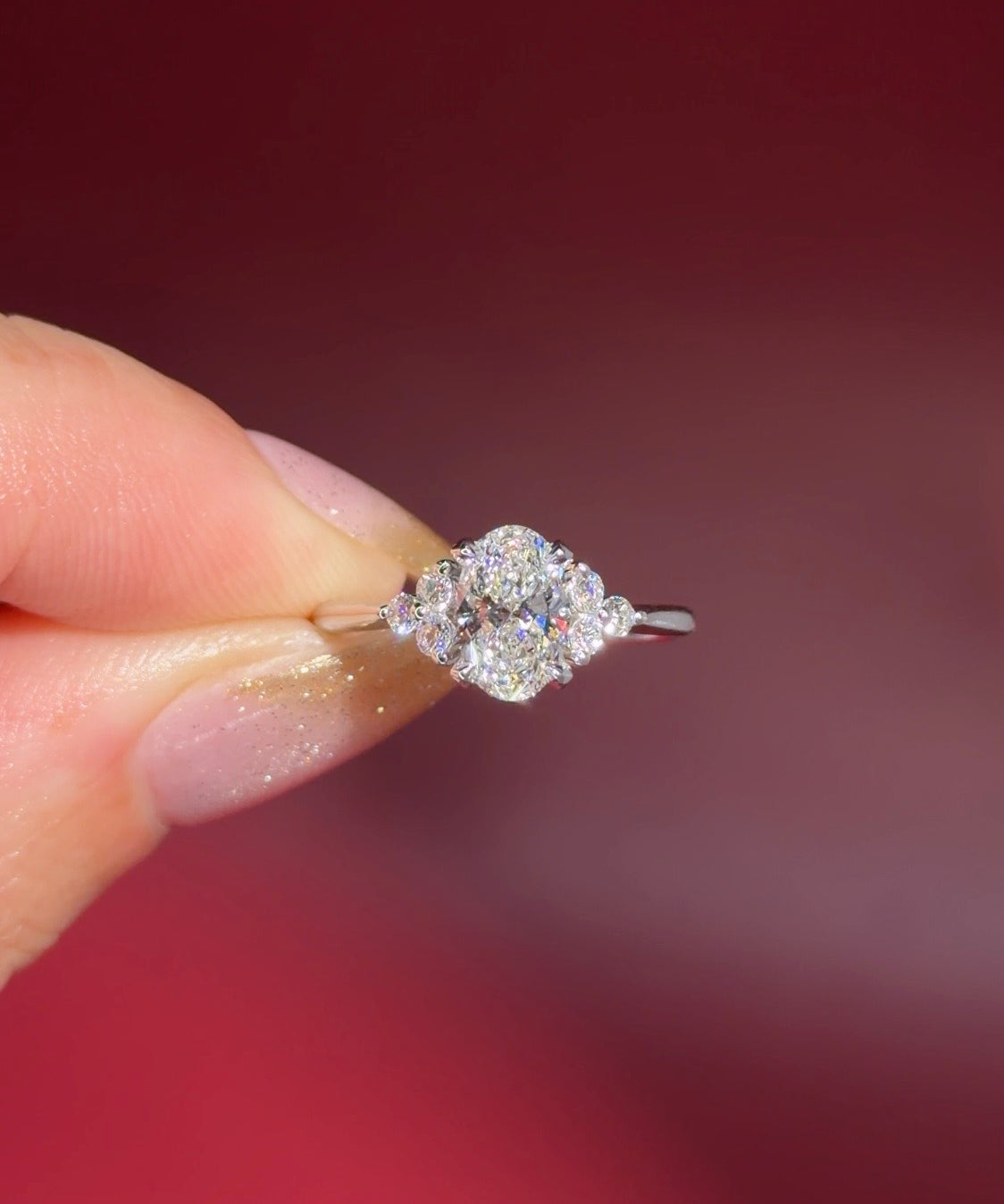 1.01ct D-VS1 Oval Lab Diamond Lindsey. The Lindsey features a classic high polish band with a trio of diamond side stones to perfectly accent your selected center stone.