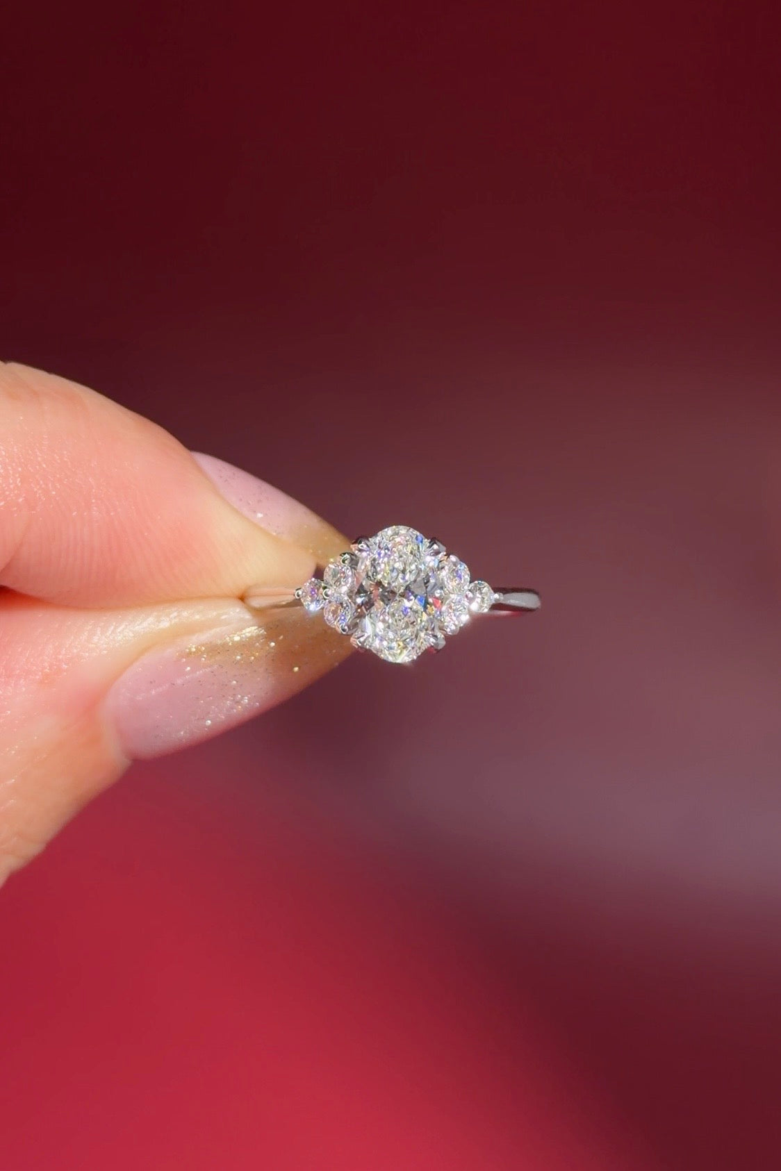 1.01ct D-VS1 Oval Lab Diamond Lindsey. The Lindsey features a classic high polish band with a trio of diamond side stones to perfectly accent your selected center stone.