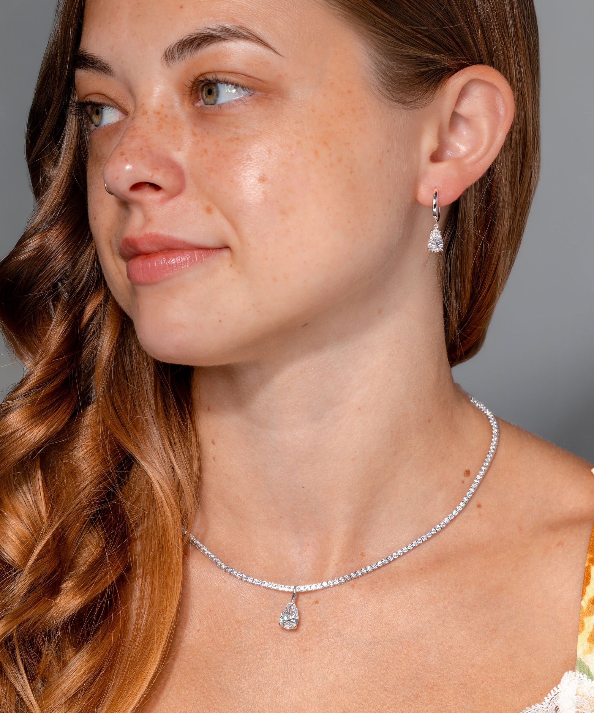 1.94ct D-VS1 Lab Diamond Pear Drop Hoops White Gold high polish with seamless snap closure at princess bride diamonds in huntington beach california on model  