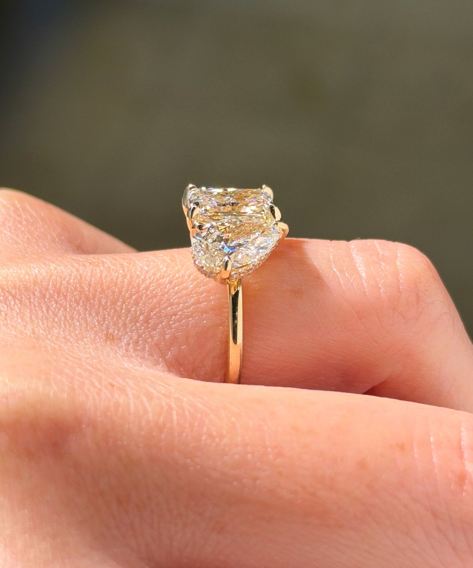 2-04ct-radiant-lab-diamond-toi-et-moi-engagement-ring-14k-yellow-gold-on-hand-side-profile-princess-bride-diamonds.jpg