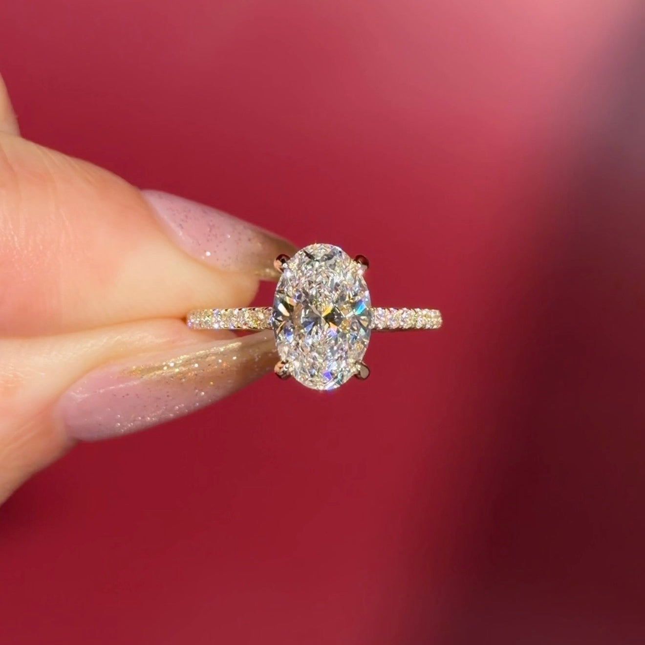 2.06ct D-VS1 Oval Lab Diamond Michelle. Cathedral style engagement ring with pavé diamonds going 75% around the ring, hidden halo, and high polish plain bridge made in solid 14k yellow gold.