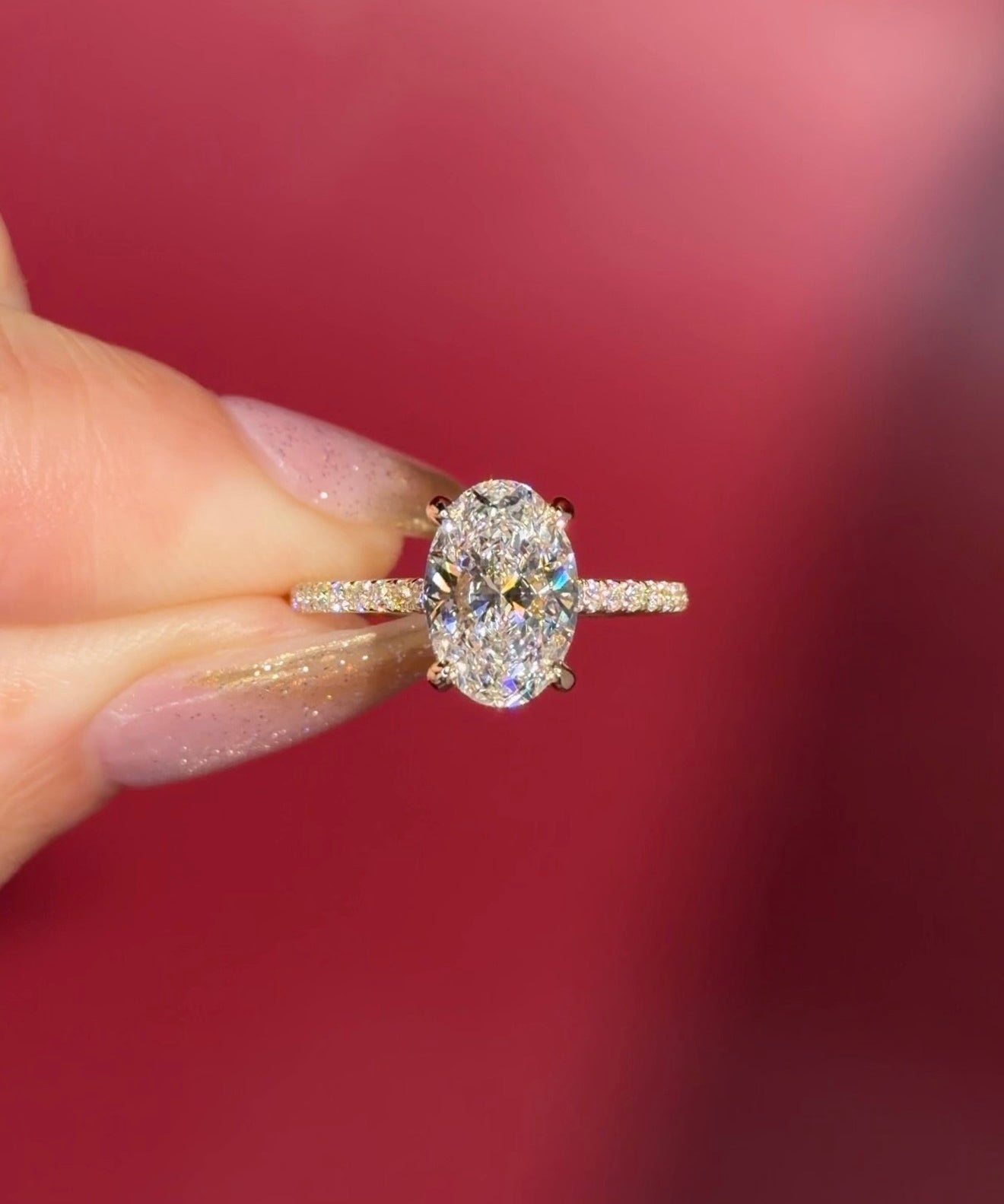 2.06ct D-VS1 Oval Lab Diamond Michelle. Cathedral style engagement ring with pavé diamonds going 75% around the ring, hidden halo, and high polish plain bridge made in solid 14k yellow gold.