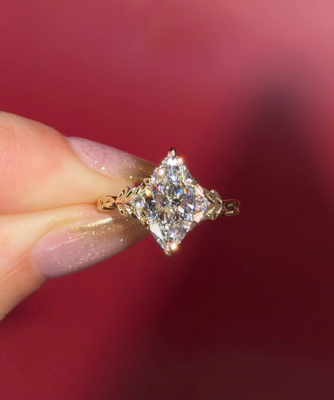 2.09ct D-VVS2 Marquise Lab Diamond Arwen. Nature inspired engagement ring with organic leaves made of gold going up the band to hold the center stone with petal prongs.