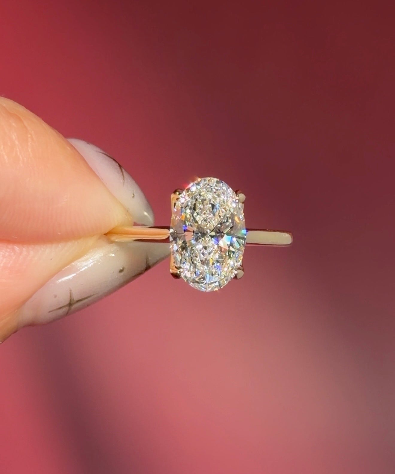 classic oval lab diamond solitaire engagement ring yellow gold cathedral setting petal prong basket