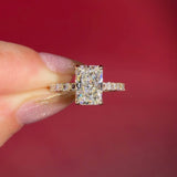 2.74ct E-VS1 Radiant Lab Diamond East West Ring. This is a traditional style engagement ring featuring a wrap under halo and east west radiant cut lab diamonds set into the band. The entire ring is made in solid 14k yellow gold.