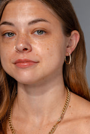 25mm Pavé Hoops Yellow Gold on ear