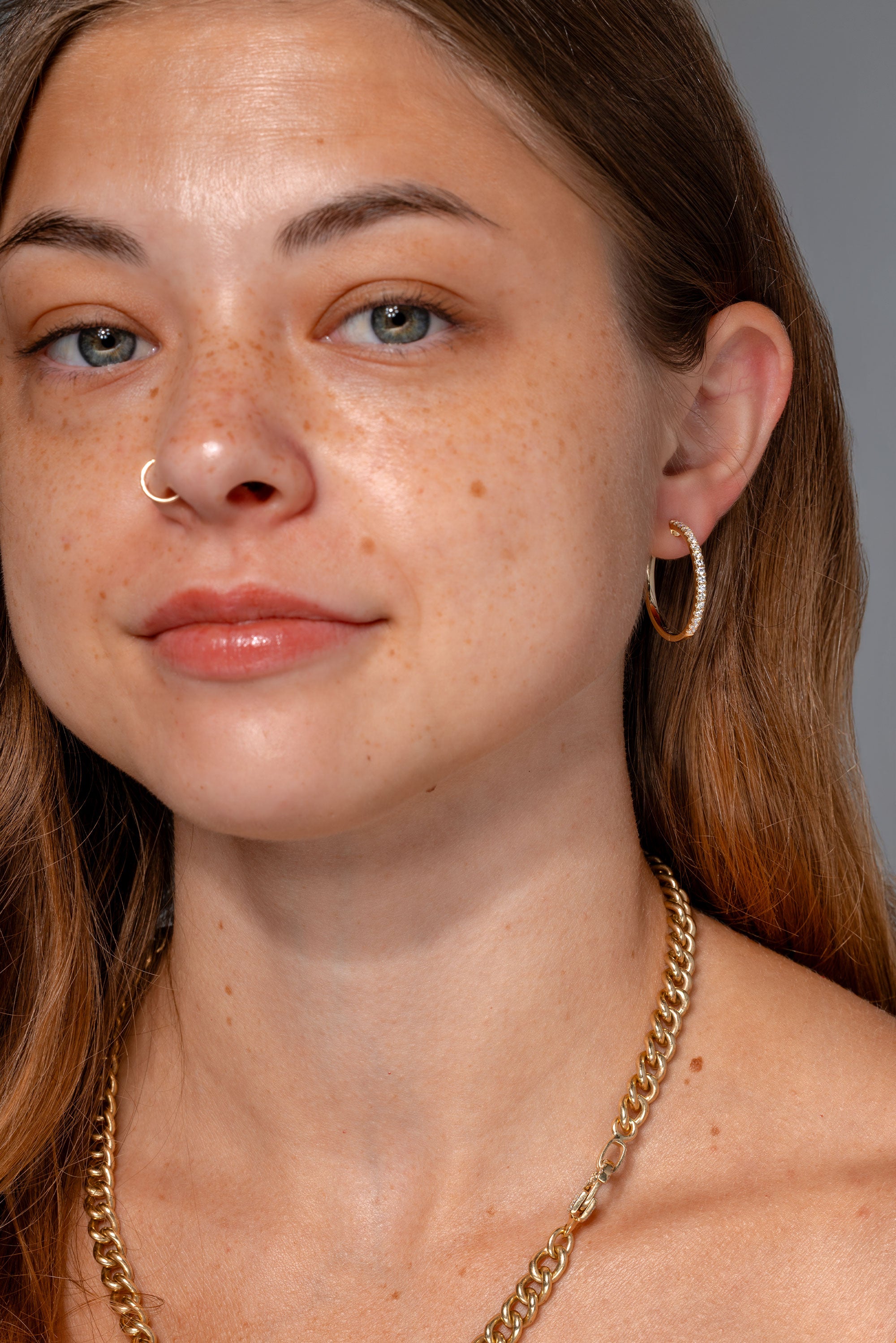 25mm Pavé Hoops Yellow Gold on ear