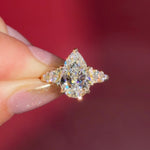 3.03ct D-VVS2 Pear Lab Diamond Brandi.

The Brandi is an inline style engagement ring featuring a symmetrical cluster of side diamonds that create a bold, sculptural look&nbsp;

Because of its inline design, straight wedding bands will not stack flush. This style pairs best with a curved or custom wedding band, or it can be worn beautifully on its own without a wedding band at all&nbsp;

A striking choice for those who love a statement engagement ring with intentional design details.