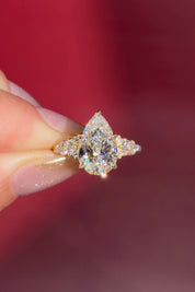 3.03ct D-VVS2 Pear Lab Diamond Brandi.

The Brandi is an inline style engagement ring featuring a symmetrical cluster of side diamonds that create a bold, sculptural look&nbsp;

Because of its inline design, straight wedding bands will not stack flush. This style pairs best with a curved or custom wedding band, or it can be worn beautifully on its own without a wedding band at all&nbsp;

A striking choice for those who love a statement engagement ring with intentional design details.