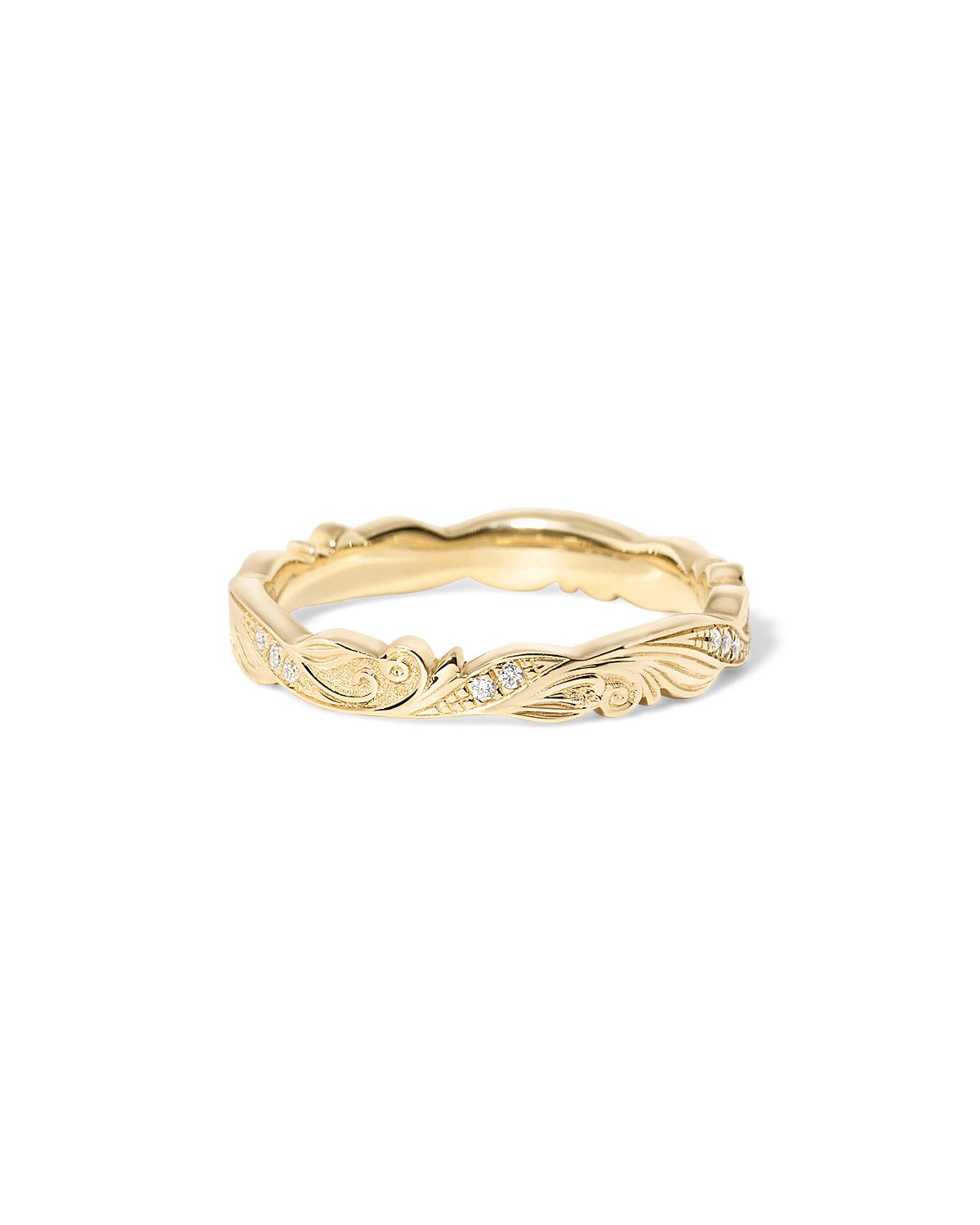 Josephine wedding band with hand-engraved scroll detailing and subtle diamond accents set in gold at Princess Bride Diamonds jewelry store in Orange County