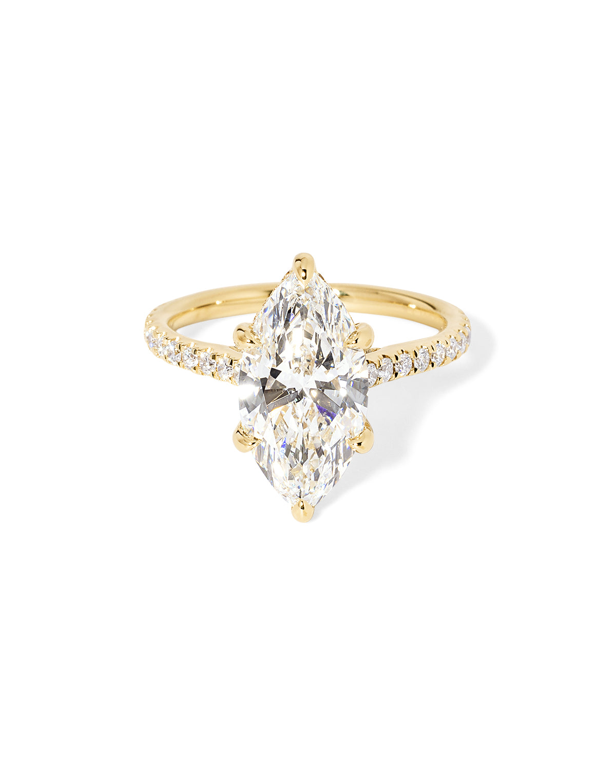 The Alice Marquise lab diamond engagement ring at Princess Bride Diamonds in Huntington Beach, California features a classic pavé diamond band with a cathedral-style setting for a higher, elegant look. It also includes a hidden under-halo beneath the center stone and a diamond bridge for added sparkle from every angle. 14k yellow gold 