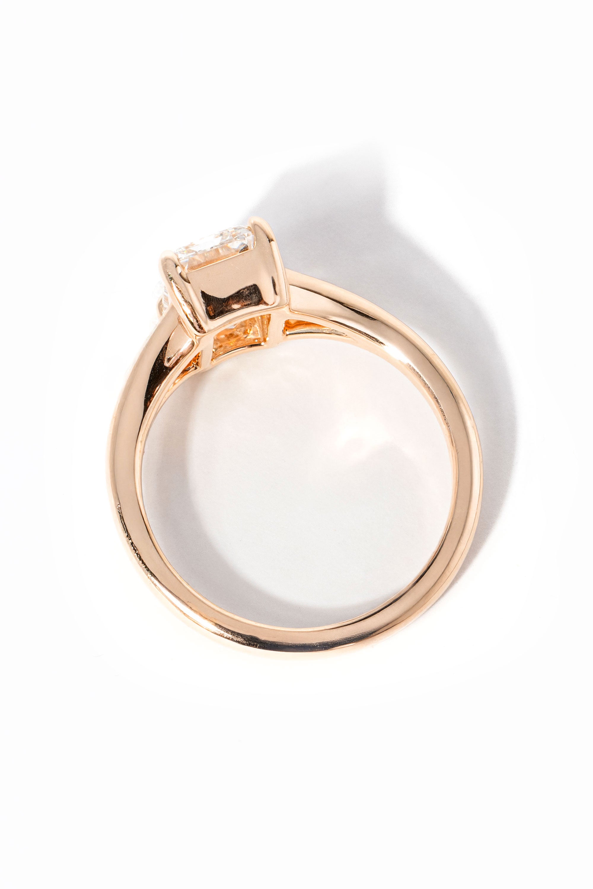 emerald cut diamond on split shank rose gold ring