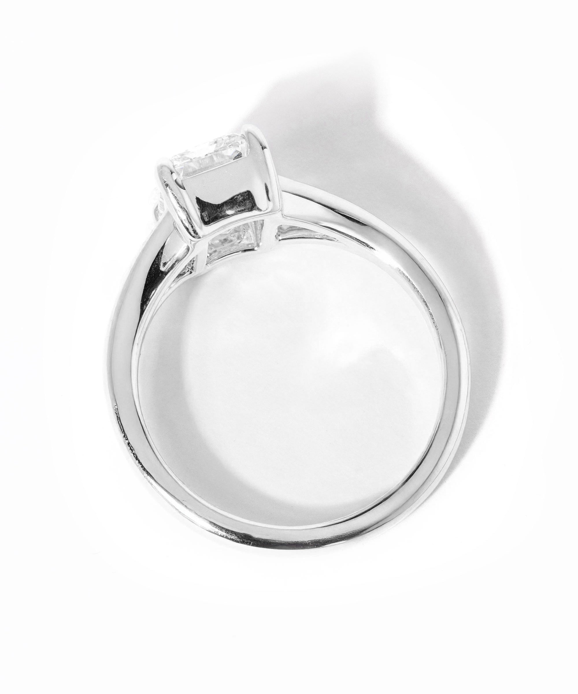 emerald cut diamond on split shank white gold ring