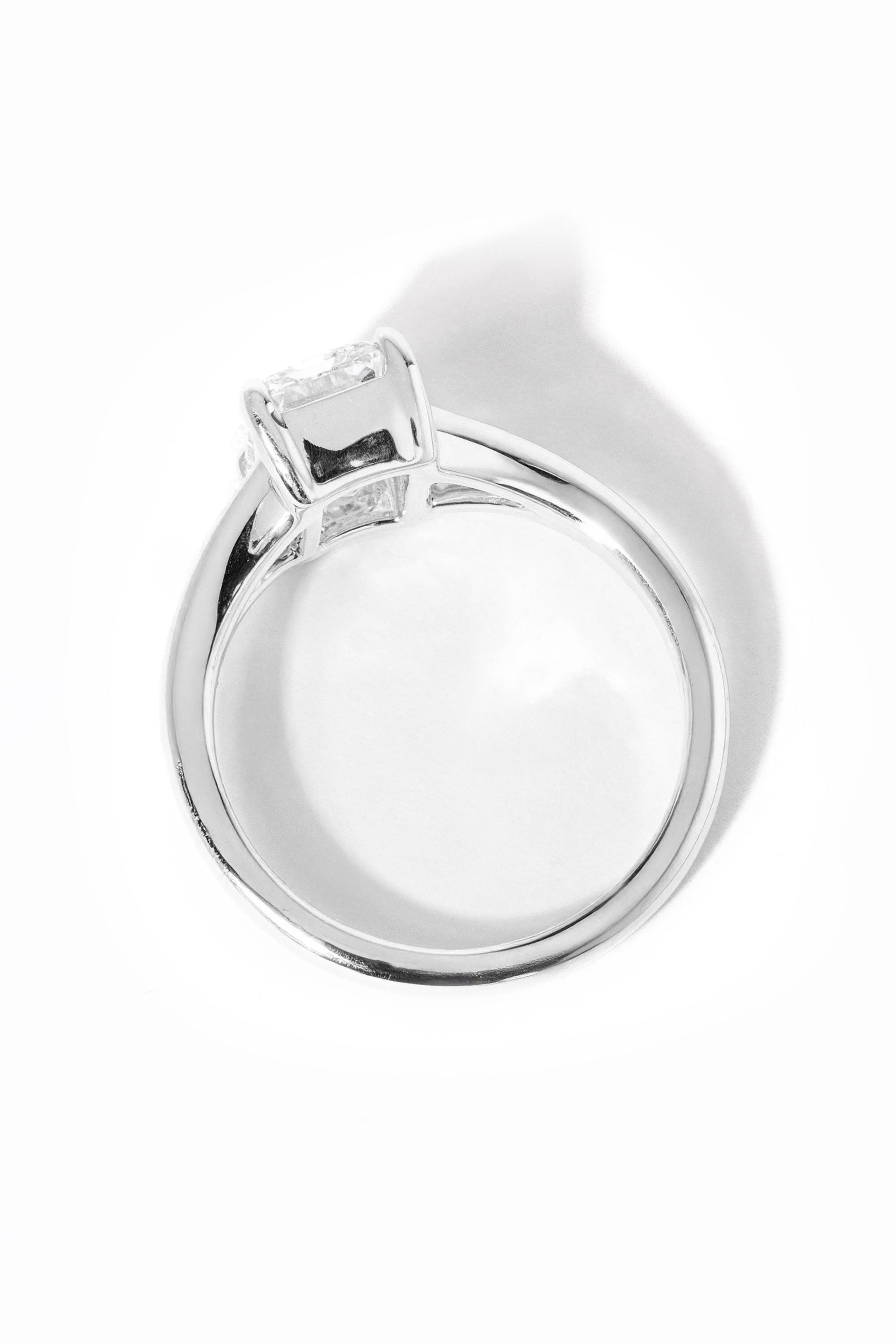 emerald cut diamond on split shank white gold ring