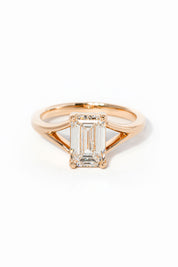 emerald cut diamond on split shank rose gold ring