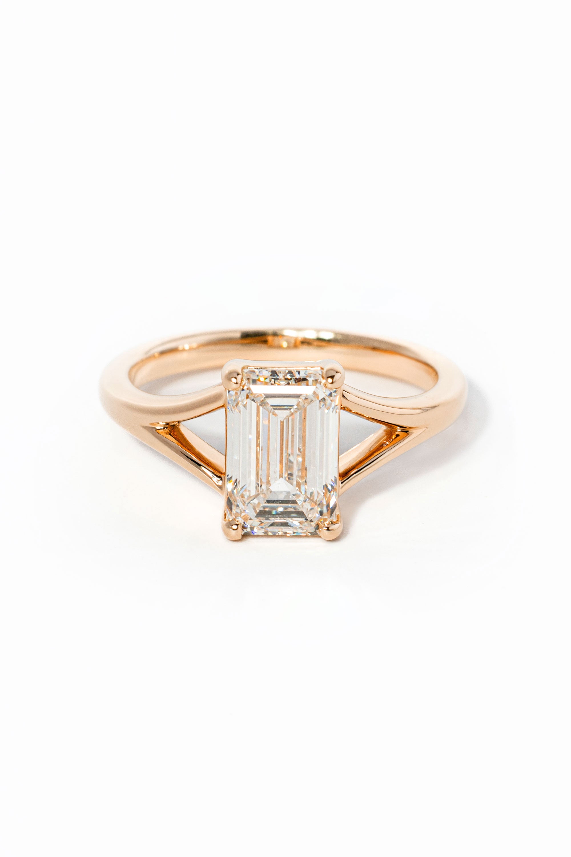 emerald cut diamond on split shank rose gold ring