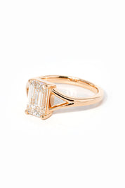 emerald cut diamond on split shank rose gold ring