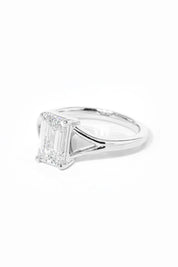 emerald cut diamond on split shank white gold ring