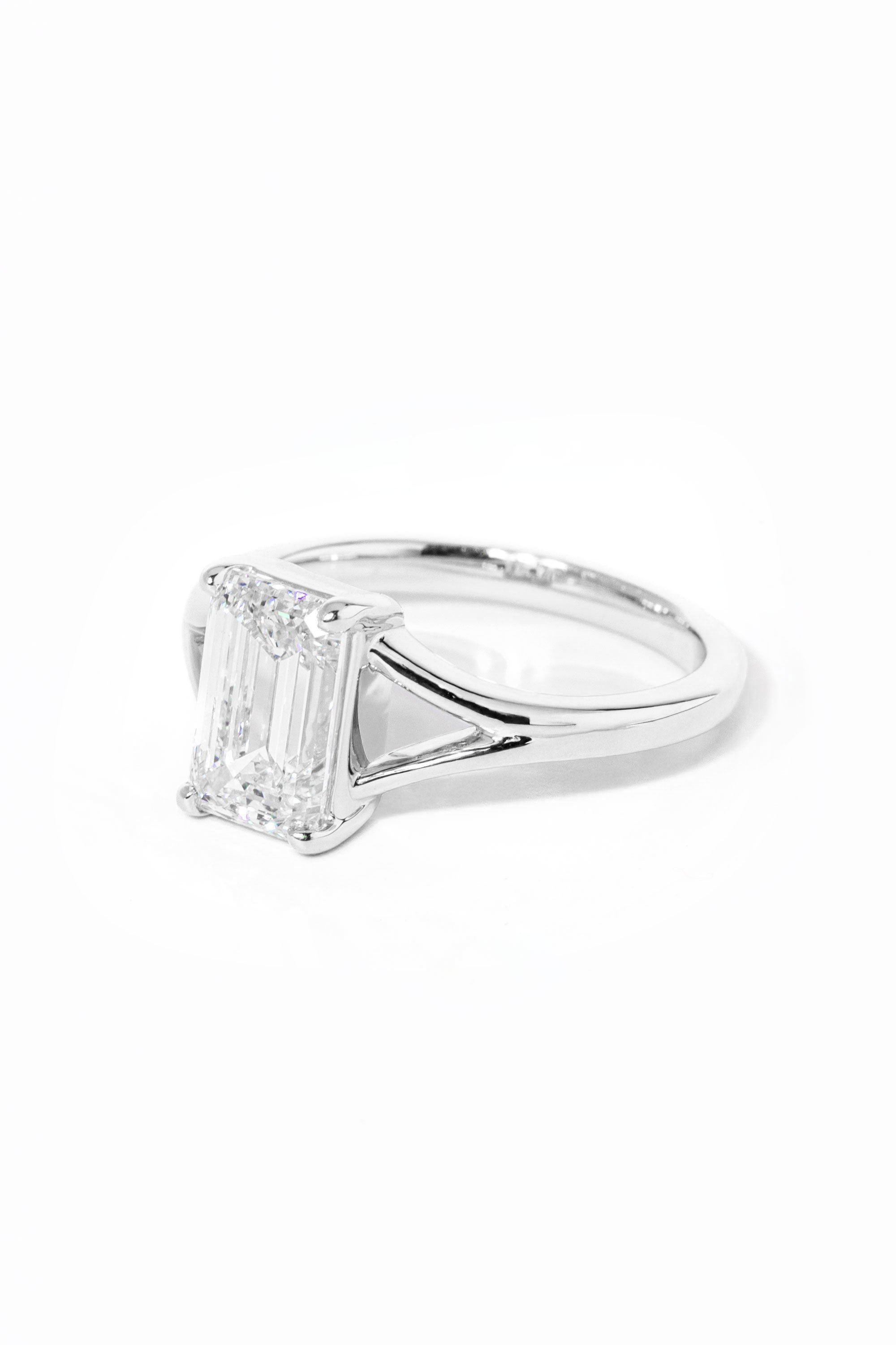 emerald cut diamond on split shank white gold ring