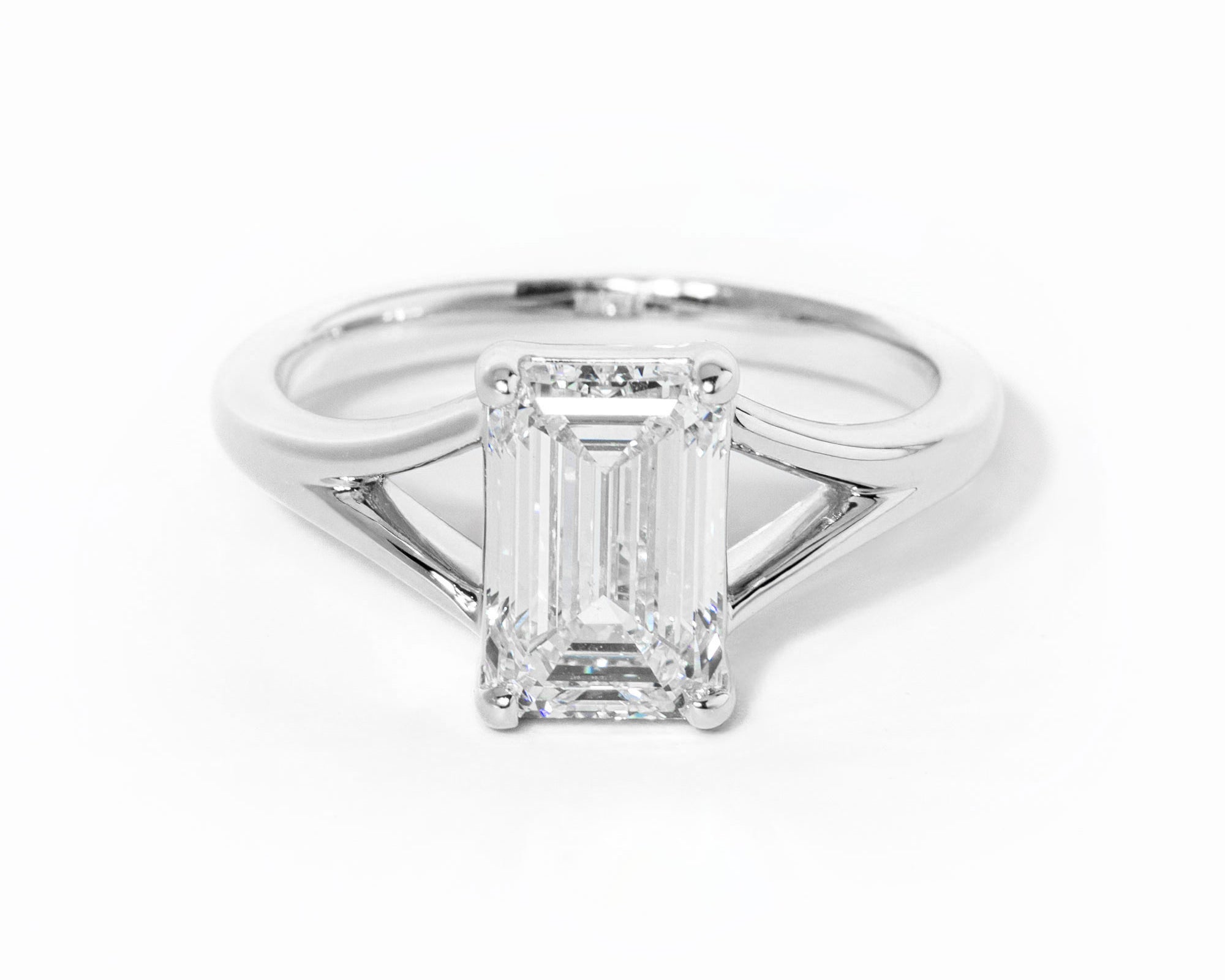 emerald cut diamond on split shank white gold ring