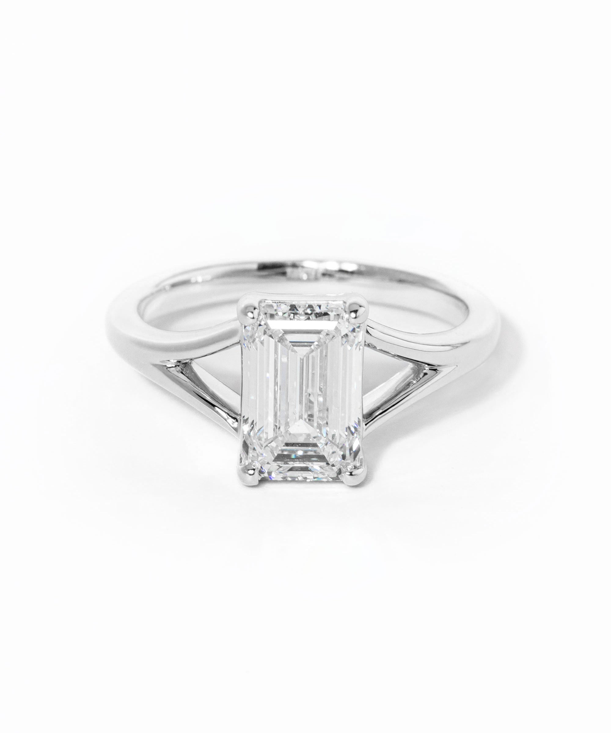 emerald cut diamond on split shank white gold ring