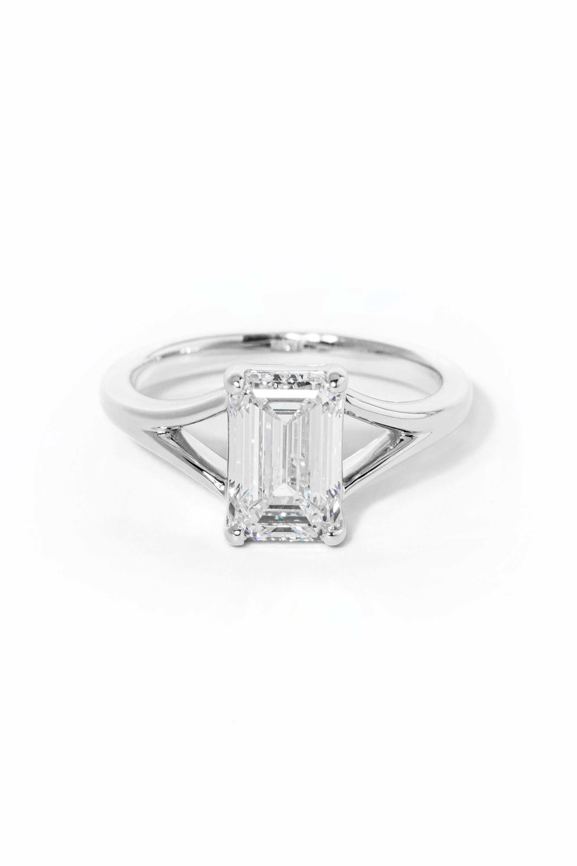 emerald cut diamond on split shank white gold ring
