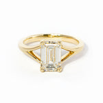 emerald cut diamond on split shank yellow gold ring