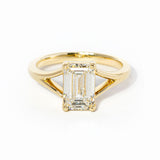 emerald cut diamond on split shank yellow gold ring