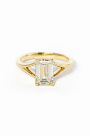 emerald cut diamond on split shank yellow gold ring