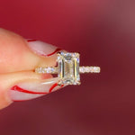 Emerald Cut Lab Diamond Solitaire in Yellow Gold with Pave diamond band and hidden halo
