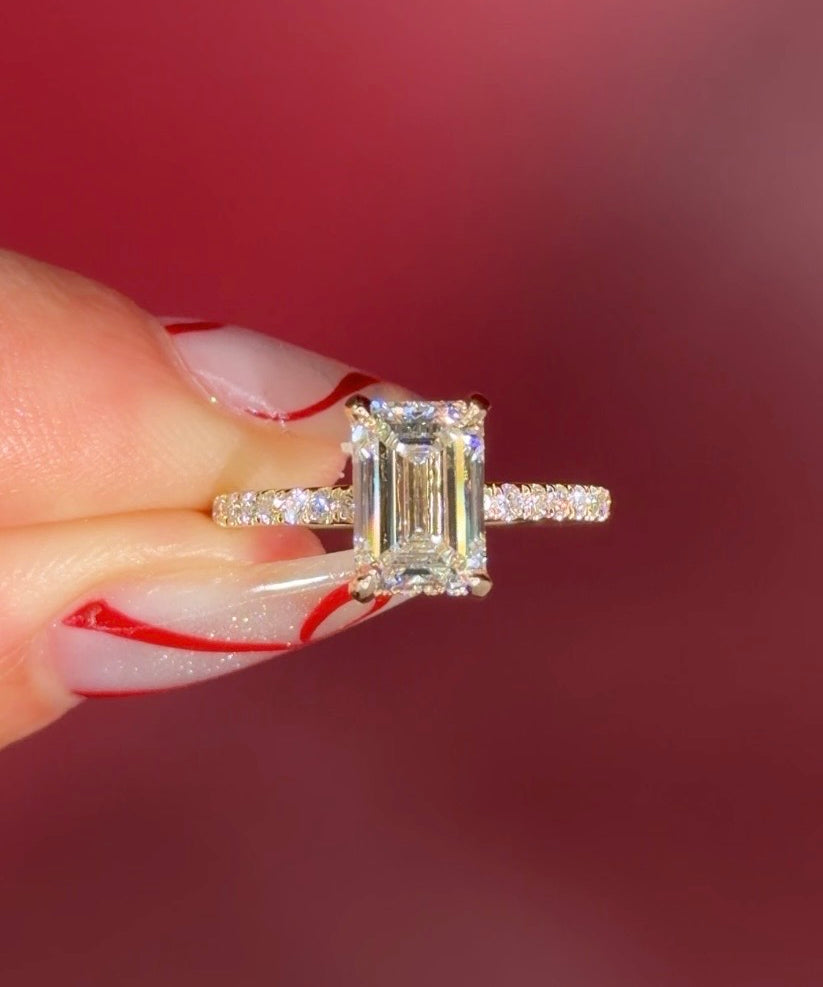 Emerald Cut Lab Diamond Solitaire in Yellow Gold with Pave diamond band and hidden halo