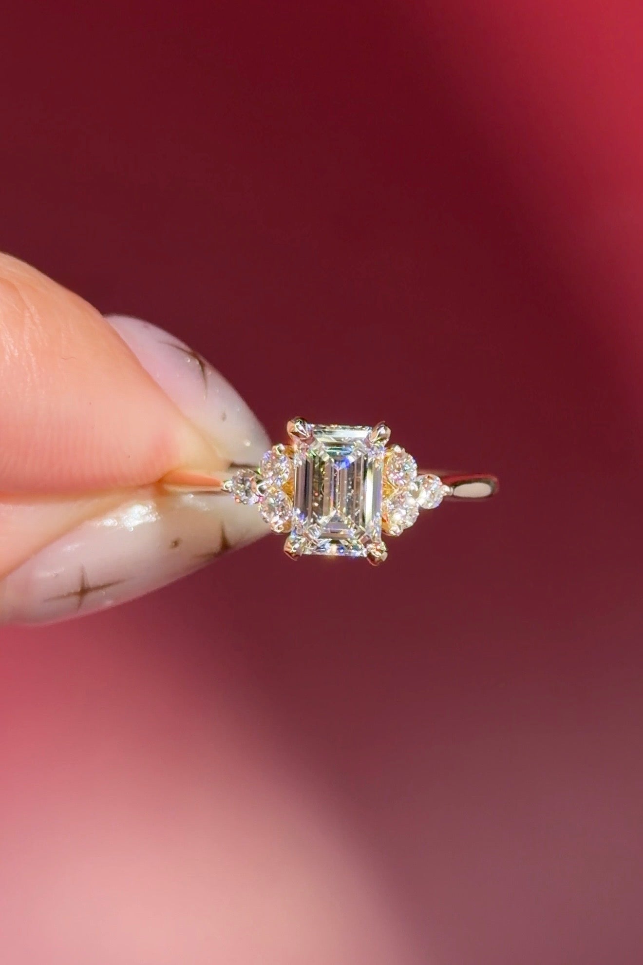 emerald lab diamond engagement ring trio side stone cluster yellow gold