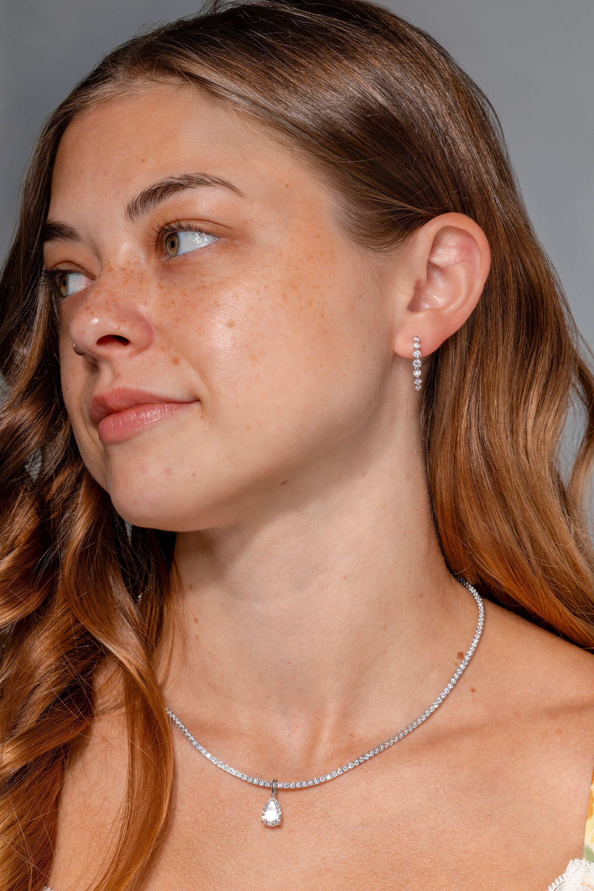 Graduating Floating Diamond Hoops Natural Diamond iat Princess Bride Diamonds Jewelry Store Huntington Beach on model