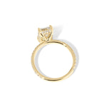 Kayla Emerald Engagement Ring with a diamond hidden halo and classic pave band featuring lab grown diamond side stones in solid yellow gold at princess bride diamonds in huntington beach california yellow gold 