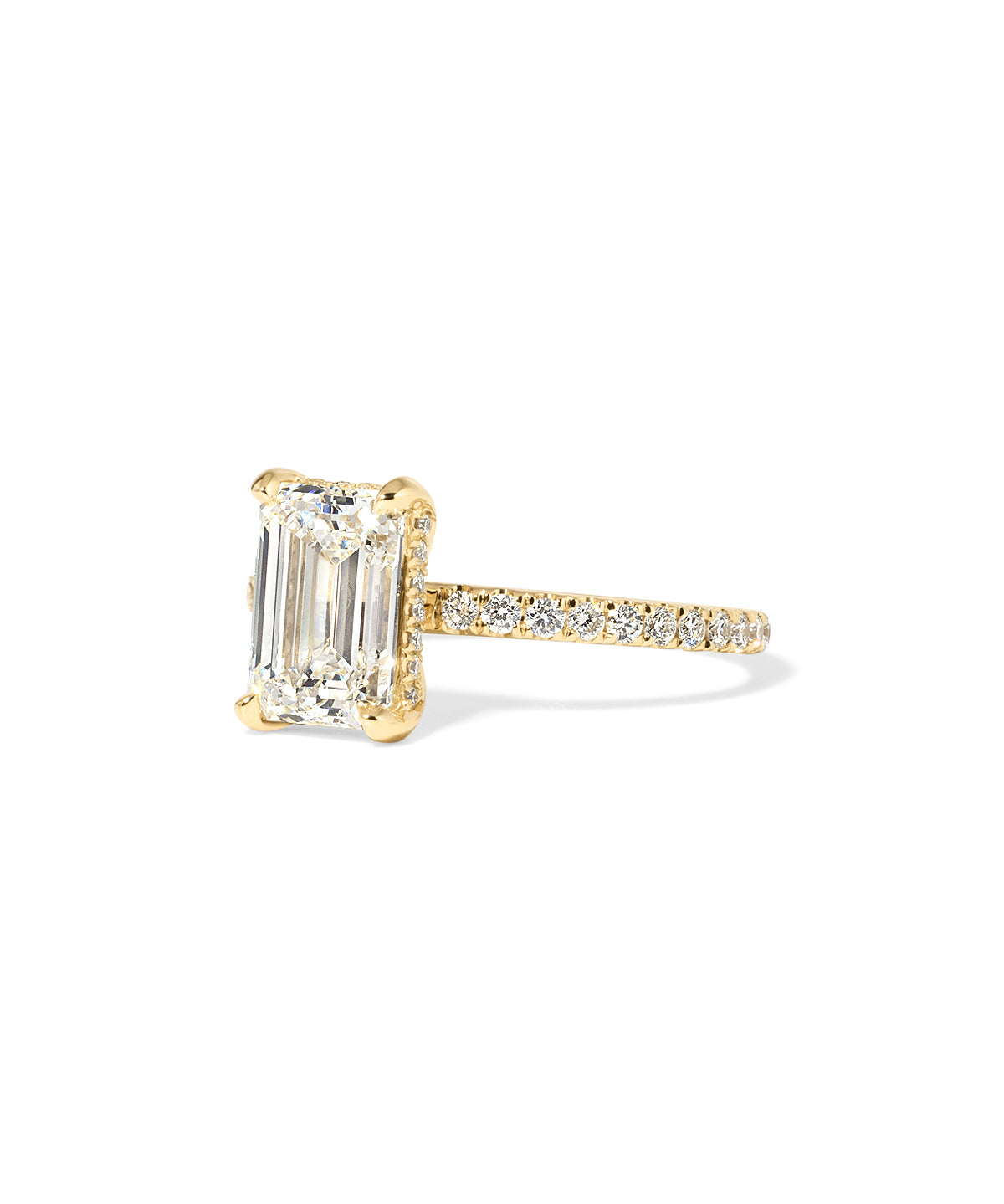 Kayla Emerald Engagement Ring with a diamond hidden halo and classic pave band featuring lab grown diamond side stones in solid yellow gold at princess bride diamonds in huntington beach california yellow gold 