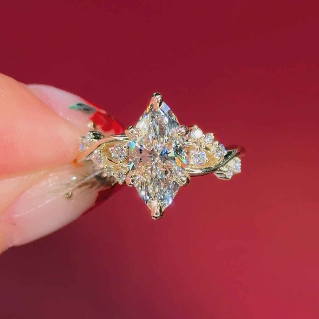 marquise diamond yellow gold engagement ring with alternating side stones