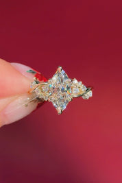 marquise diamond yellow gold engagement ring with alternating side stones