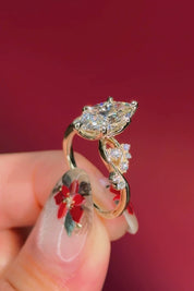 marquise diamond yellow gold engagement ring with alternating side stones