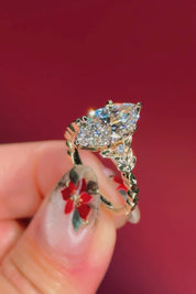 marquise diamond leafy nature inspired yellow gold engagement ring