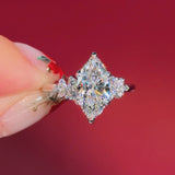 marquise diamond cluster white gold engagement ring