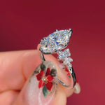 marquise diamond cluster white gold engagement ring