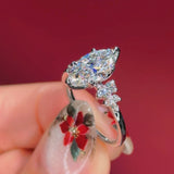 marquise diamond cluster white gold engagement ring