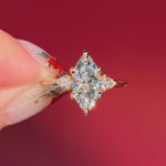 marquise yellow gold engagement ring with pear side stones