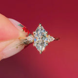 marquise yellow gold engagement ring with pear side stones