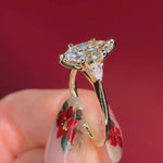 marquise yellow gold engagement ring with pear side stones