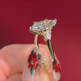 marquise yellow gold engagement ring with pear side stones